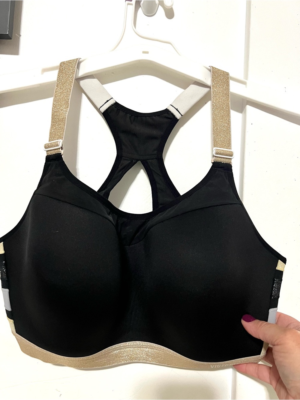 Victoria's Secret Black Racerback Sports Bra with Gold-Strap Accents